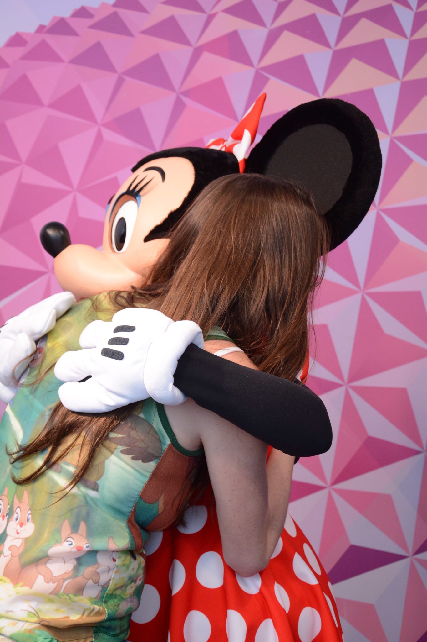 Chelsea gets a big hug from Minnie Mouse at the Visa Photo Spot.