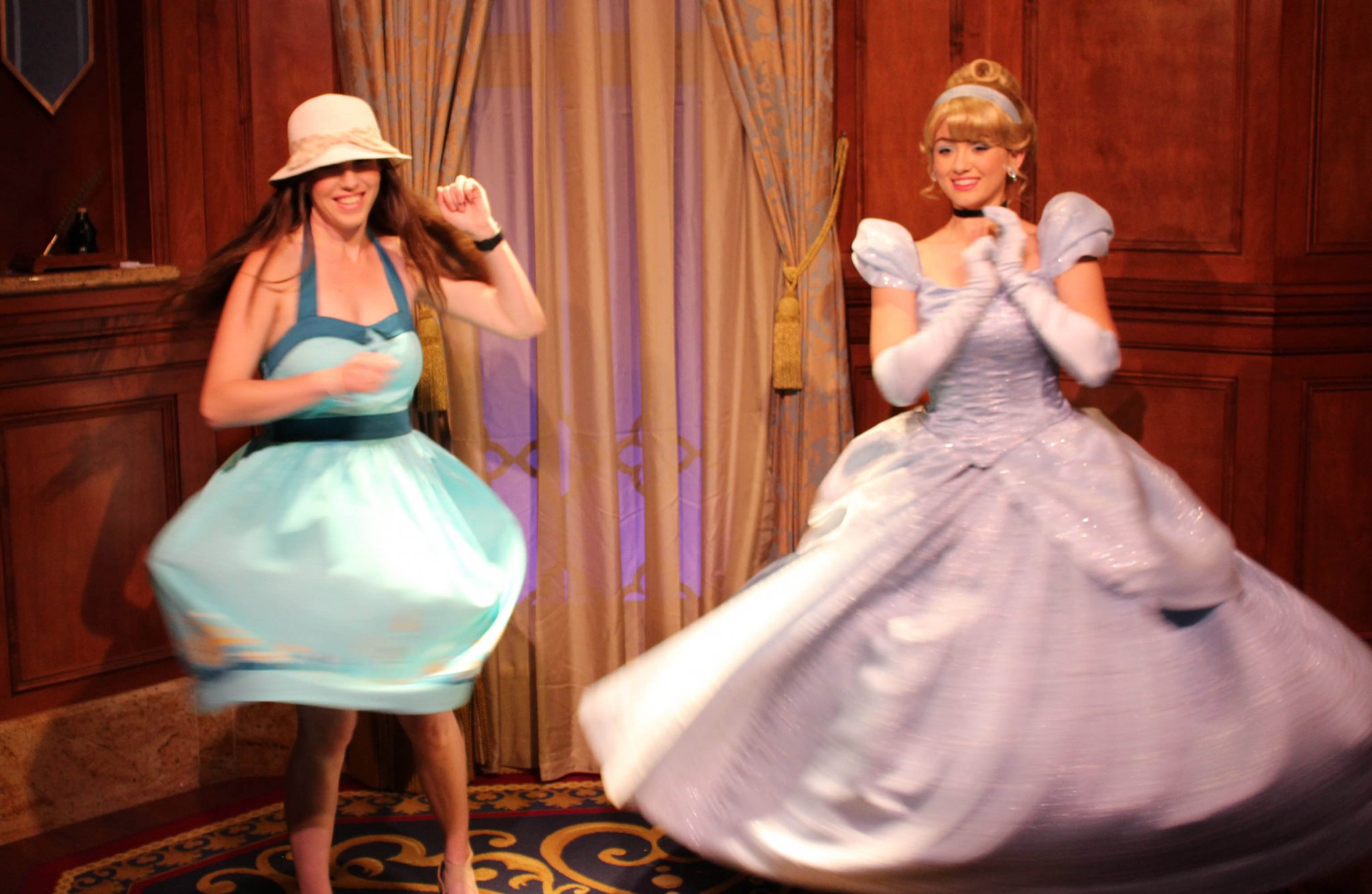 Chelsea twirling in her Dapper Day dress at Princess Fairy Tale Hall with Cinderella.