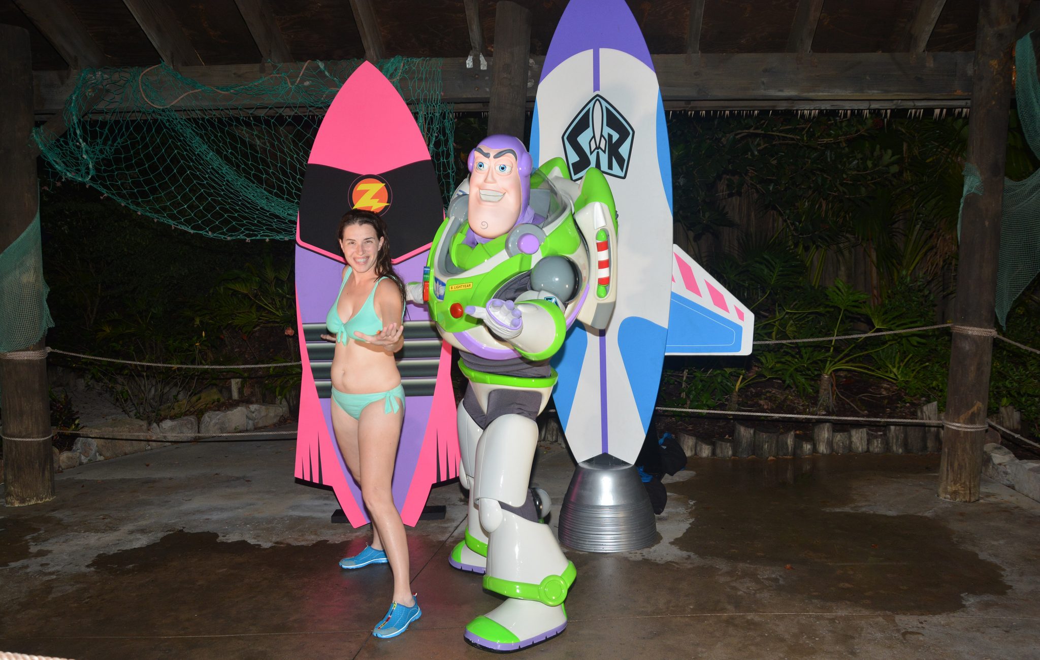 Chelsea "surfing" with Buzz during H2O Glow Nights.