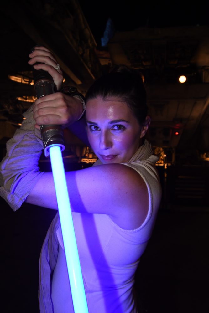 Chelsea with her lightsaber in Star Wars Galaxy's Edge